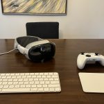 A headset with a keyboard, trackpad, and video game controller