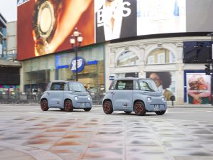 A pair of Citroen Amis parked next to Piccadilly Circus in London