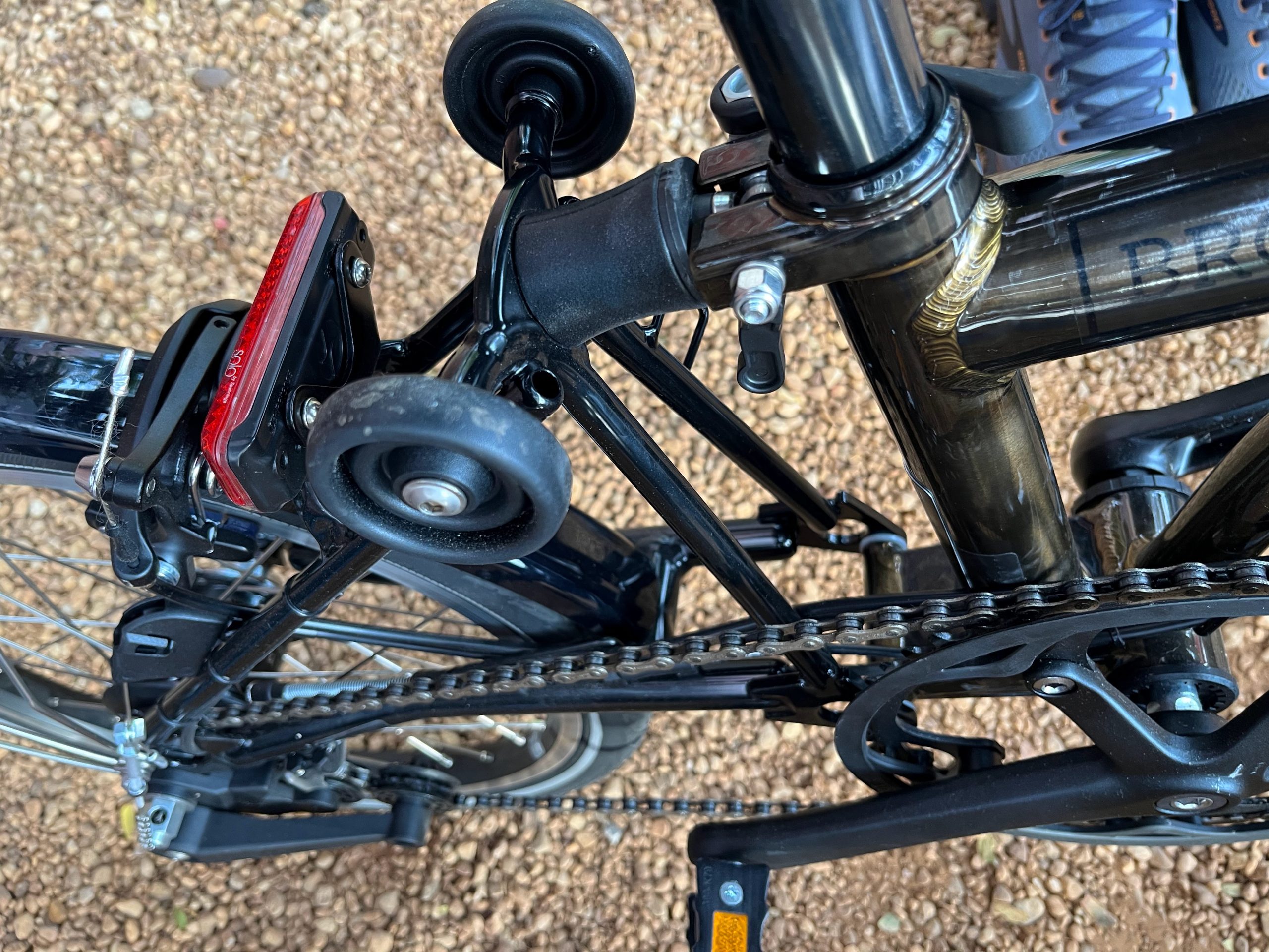 Shot of the back of a Brompton, close up on the roller wheels.