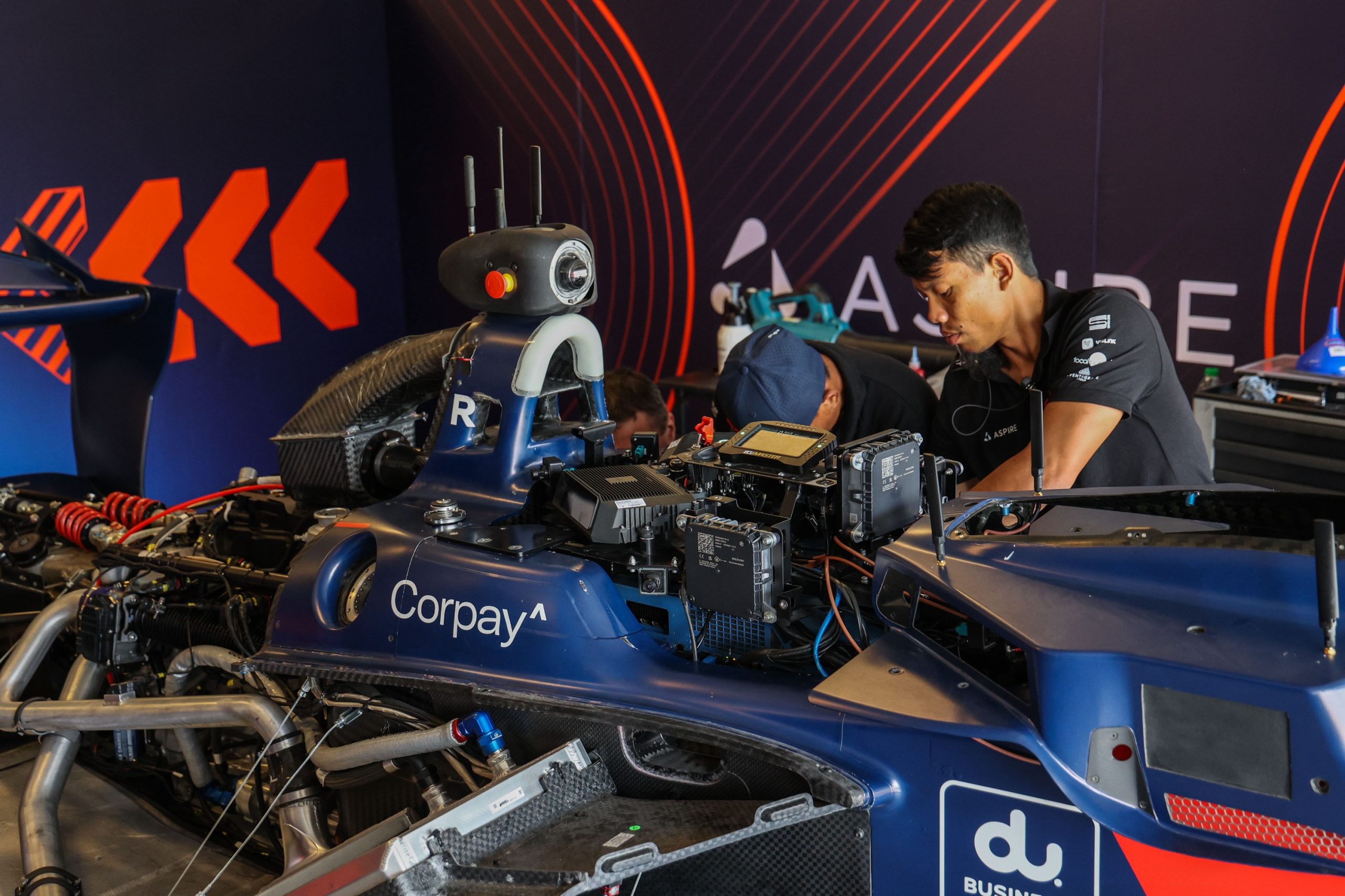 two engineers works on a driverless race car