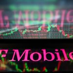 T-Mobile logo displayed in front of a stock market chart.