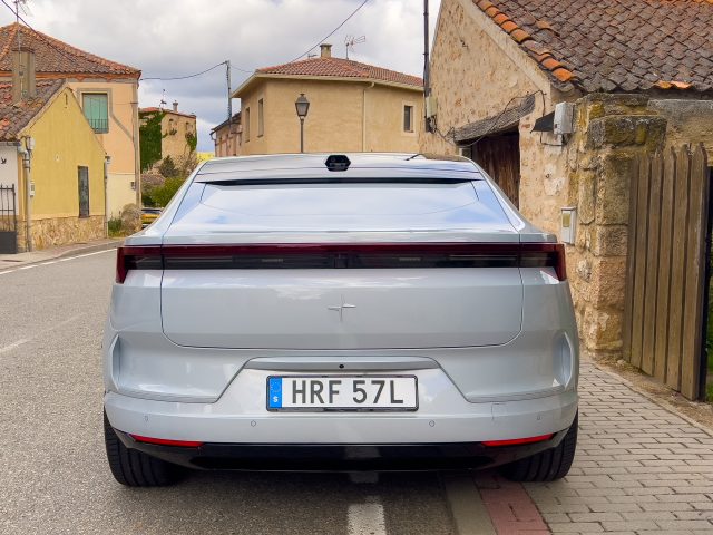 A grey Polestar 4 seen from the rear