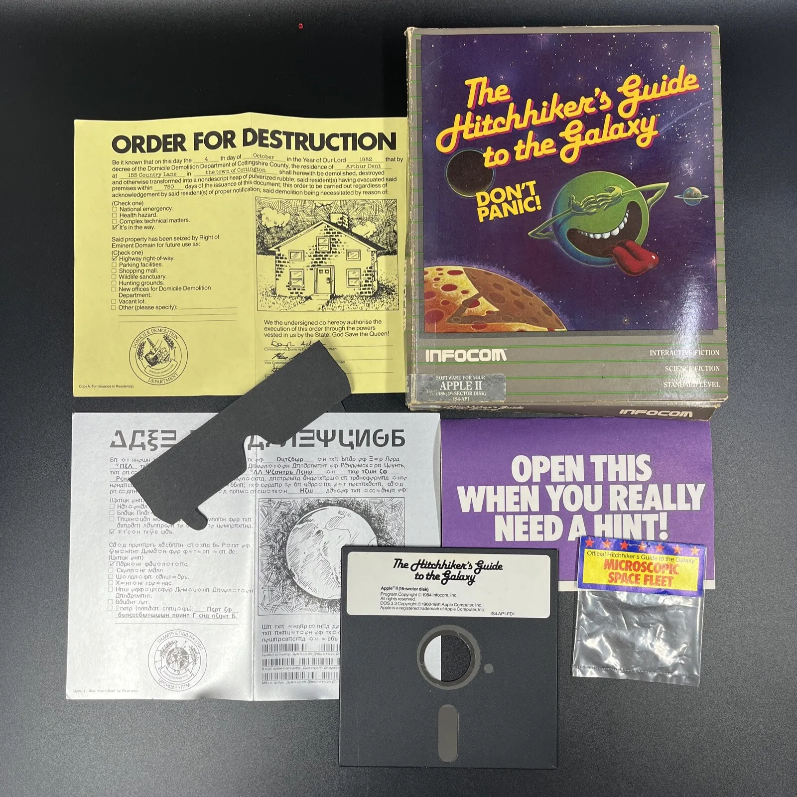 The various pieces of an Infocom box, including a manual, a disk, and more