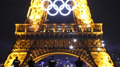 Police observe the Eiffel Tower from Trocadero ahead of the Paris 2024 Olympic Games.