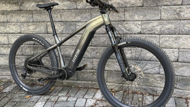 Image of a large, rugged frame with hefty wheels and a straight handlebar.