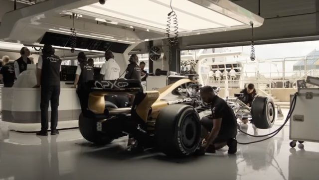 F1 car being services in a garage