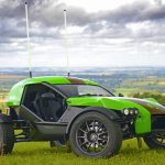 A green and black Ariel E-Nomad seen in the English countryside