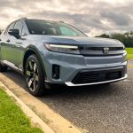 A grey Honda Prologue parked in a park