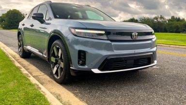 A grey Honda Prologue parked in a park