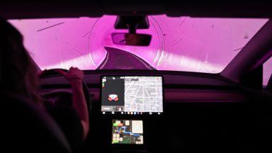 A Tesla Inc. electric vehicle is driven through a tunnel in the Boring Company's Las Vegas Convention Center Loop during the Consumer Electronics Show (CES) in Las Vegas, Nevada, on January 5, 2023.