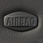 Macro of car airbag sign on leather