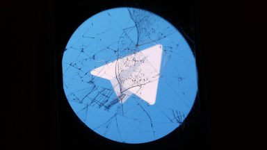 Telegram logo displayed on a phone screen is seen through the broken glass in this illustration photo taken in Krakow, Poland on August 27, 2024.