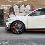 The front half of a white Ioniq 5 N in an alleyway