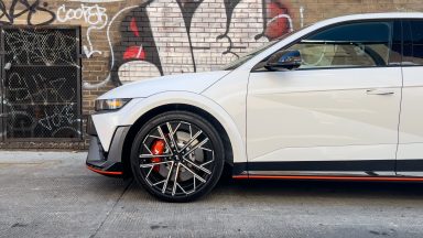 The front half of a white Ioniq 5 N in an alleyway