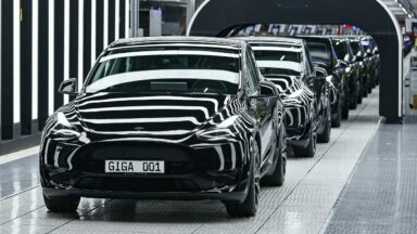 A line of electric vehicles of the model Y is pictured during the start of the production at Tesla's "Gigafactory" on March 22, 2022 in Gruenheide, southeast of Berlin