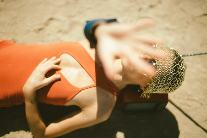 Woman in orange dress at beach by Pawel Szvmanski?width=698&height=466&fit=crop&auto=webp