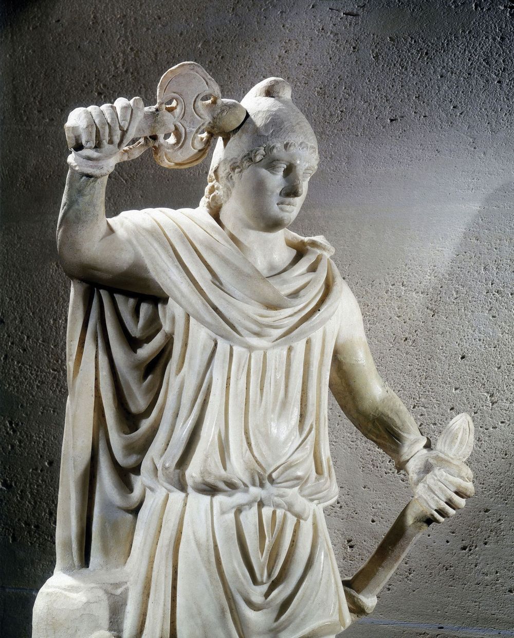 Mithras, ancient Persian god of light. Statue of Mithras, adopted into the Roman pantheon in the 1st c. BC, shown wearing the Phrygian cap. In the Louvre Museum, Paris, France. Confirm dimensions, materials, date.