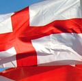 Flag of England. English flags blow in wind. White flag with red cross the Cross of St. George. heraldry, St. George flag