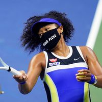 Naomi Osaka, of Japan, fires a ball into the stands after defeating Shelby Rogers, of the United States, during the quarterfinal round of the US Open tennis championships, Tuesday, Sept. 8, 2020, in New York.