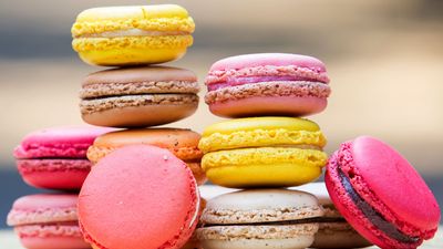 Macaron. Colorful stack of macaron pastries on a table. Sweet meringue-based confection made with egg white, icing sugar, almond powder and food clothing. Food, French cuisine, dessert, pastries, cookies