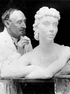 Frank Dobson working on a sculpture of British actress Margaret Rawlings.