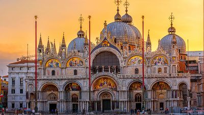 View of Basilica di San Marco and on piazza San Marco in Venice, Italy. Architecture and landmark of Venice. Sunrise cityscape of Venice.