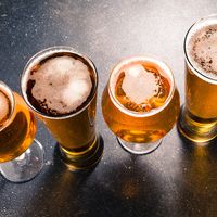 Beer glasses on dark table