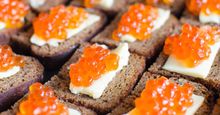 Red caviar on rye bread and butter, salmon