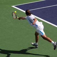 young man playing tennis