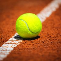 Green Tennis Ball on a tennis court