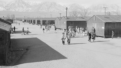 High school recess period, Manzanar Relocation Center (internment camp, Japanese-Americans), near Lone Pine, California. Photograph by Ansel Adams, 1943.