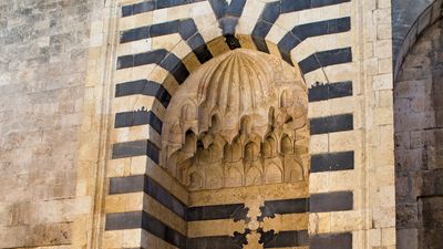 Explore the imposing ancient citadel of Aleppo and observe the damage wrought to it by the Syrian Civil War