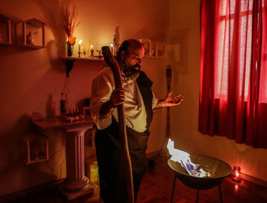 Wiccan high priest performing a Lughnasadh ritual