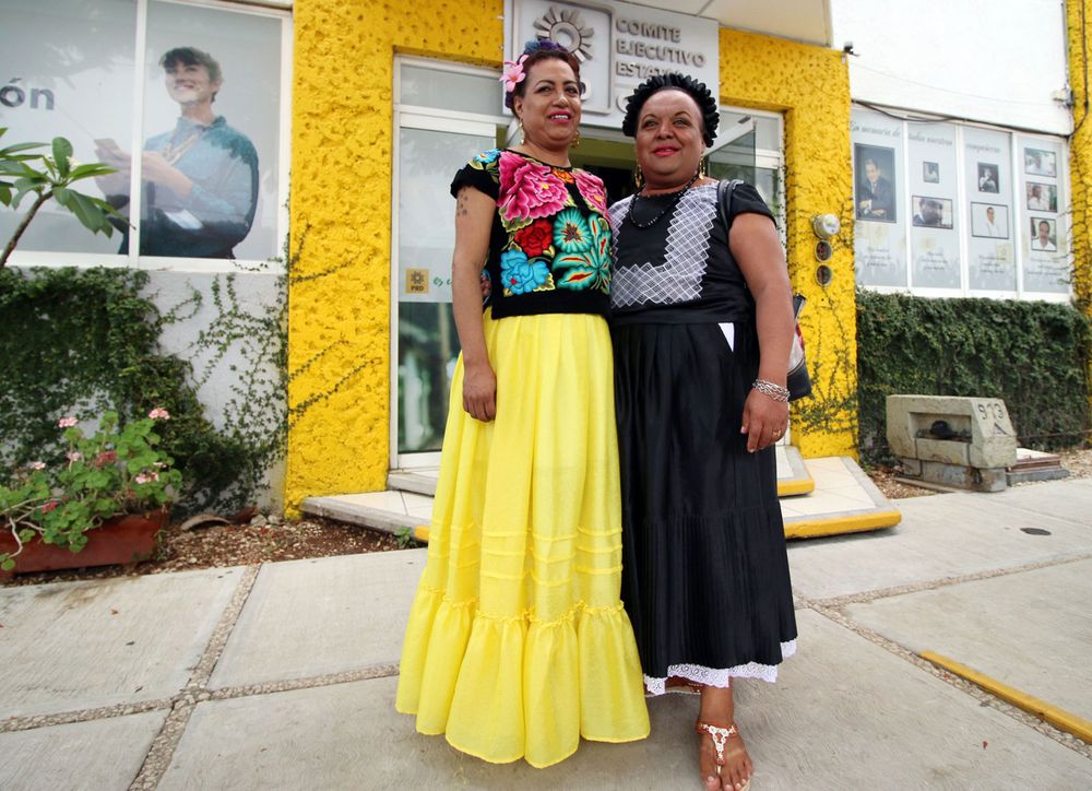 The candidate for local deputy for the Party of the Democratic Revolution (PRD) Felina Santiago Valdivieso (left) and her substitute Mistica Sanchez Gomez -both members of the Muxe community- pose for a picture after announcing their official registration before the PRD State Steering Committee (CDE), in Oaxaca, Oaxaca state, Mexico on May 14, 2018. (transgender, gender identity, gender expression)