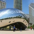 Tourists visit "Cloud Gate", a sculpture by Anish Kapoor, in Millenium Park in Chicago, Illinois.