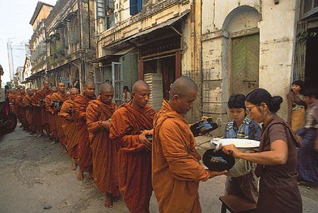 Monks receiving alms