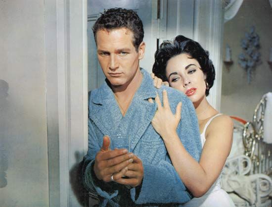 Brick (Paul Newman) and Maggie (Elizabeth Taylor) in a film adaptation of Tennessee Williams's Cat on a Hot Tin Roof (1958), directed by Richard Brooks.