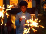 Ramadan. Little boy with sparklers. During the holy month of Ramadan Muslims break their fast each evening with prayer followed by festive nighttime meals called iftars. Islam