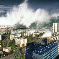 Digitally altered image of tsunami waves sweeping over city (digital alteration; natural disaster)