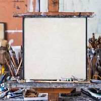 Blank canvas in an artist's studio. Art; oil paints; brushes; artists' tools