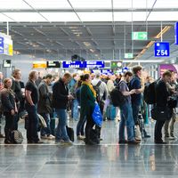 Passengers waiting in a row for boarding on an airport to a flight to America