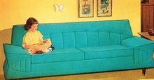 Girl Reading On Turquoise Couch