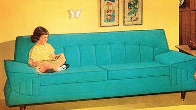 Girl Reading On Turquoise Couch