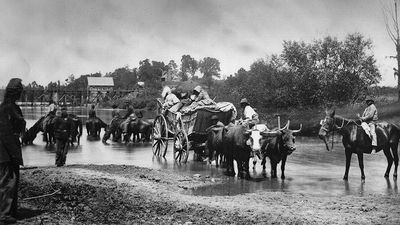 A group of fugitive African Americans crossing the Rappahannock River in Virginia, 1862, during the United States Civil War. Fugitive slaves, escaped slaves, runaway slaves. Photographer Timothy O'Sullivan.