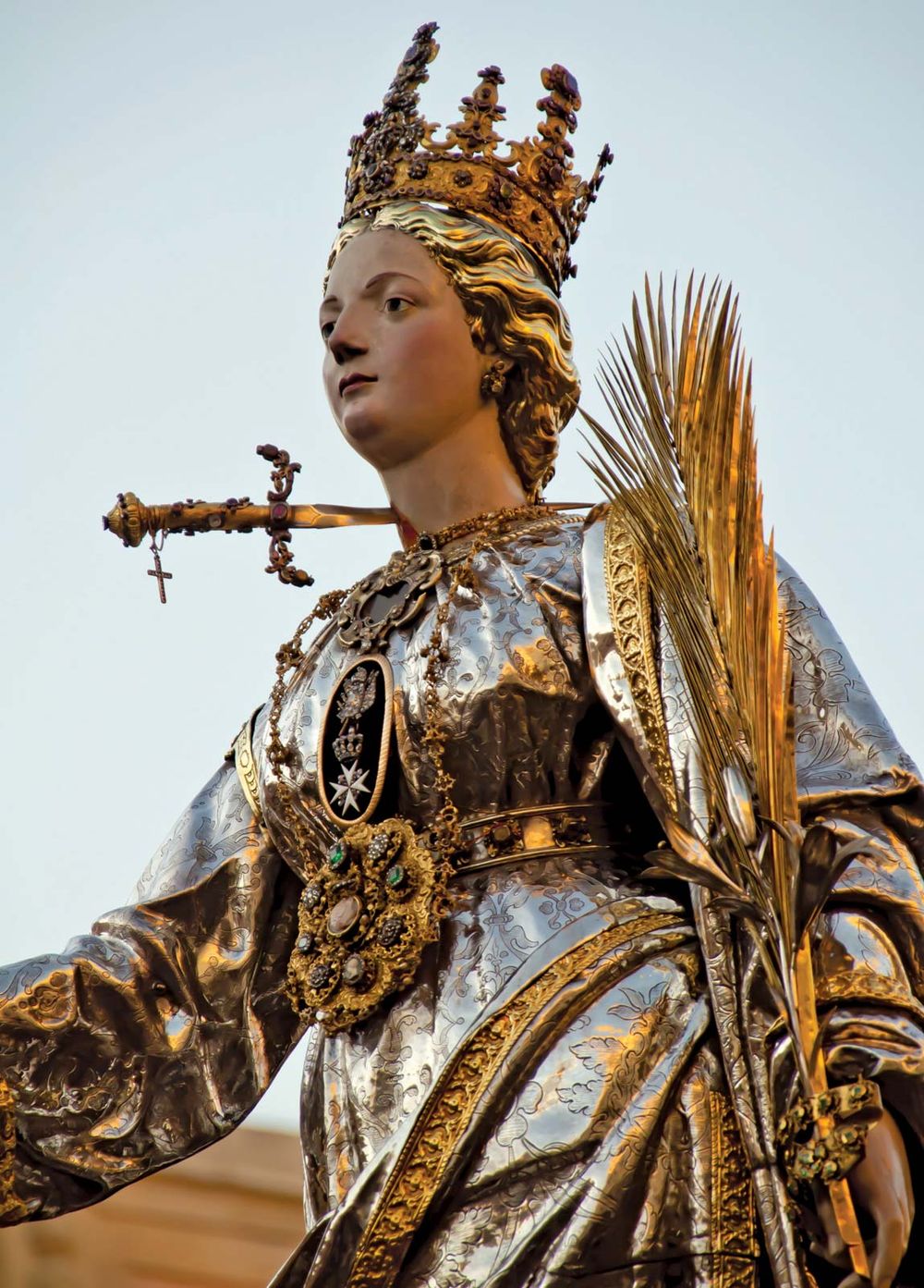 Saint Lucy. St. Lucia's Day. Saint Lucia Day. Feast of Saint Lucia procession in Syracuse, Italy, December 13. Marks beginning of Christmas season. Christian saint, virgin and martyr died 304 when her neck was pierced by a sword. Luciadagen