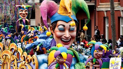 Crowds reach for beads as the Jester float in the traditional Rex parade rolls down Canal Street on Mardi Gras March 8, 2011, New Orleans, Louisiana. Fat Tuesday aka Shrove Tuesday final day of Carnival, day before Ash Wednesday, first day of Lent.