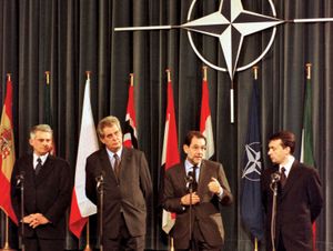 Jerzy Buzek, Miloš Zeman, Javier Solana, and Viktor Orbán at a ceremony marking the accession of the Czech Republic, Hungary, and Poland to NATO