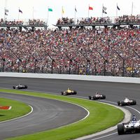 The field takes the turn one after the restart during the 103rd Indianapolis 500 at Indianapolis Motor Speedway on May 26, 2019 in Indianapolis, Indiana.  (auto racing, Indy 500)