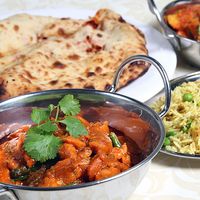 Indian meal of chicken keema, curry, rice, and naan bread.  (Pakistani meal; curried food; Indian food; Pakistani food)