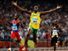 Usain Bolt of Jamaica reacts after breaking the world record with a time of 19.30 to win the gold medal as Churandy Martina (left) of Netherlands Antilles and Brian Dzingai of Zimbabwe come in after him in the Men's 200m Final at the National Stadium during Day 12 of the Beijing 2008 Olympic Games on August 20, 2008 in Beijing, China. (Summer Olympics, track and field, athletics)